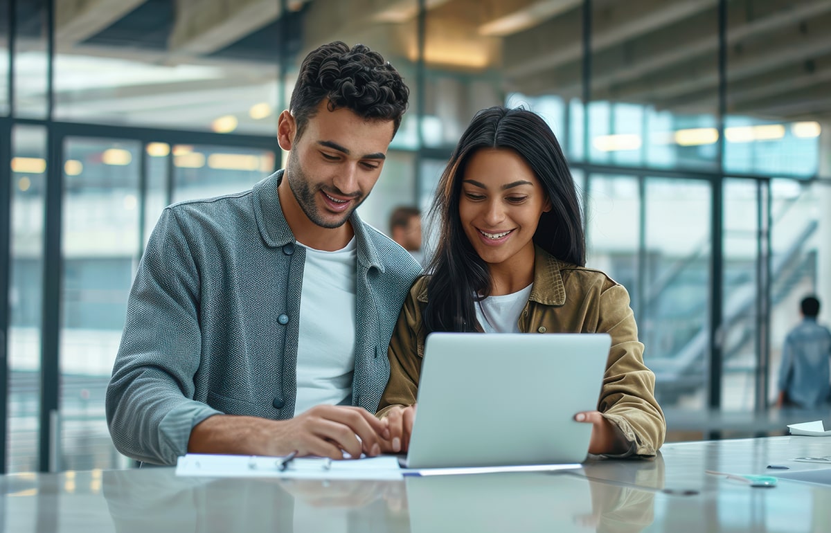 its-up-both-us-bring-results-shot-young-businessman-businesswoman-using-lap-min